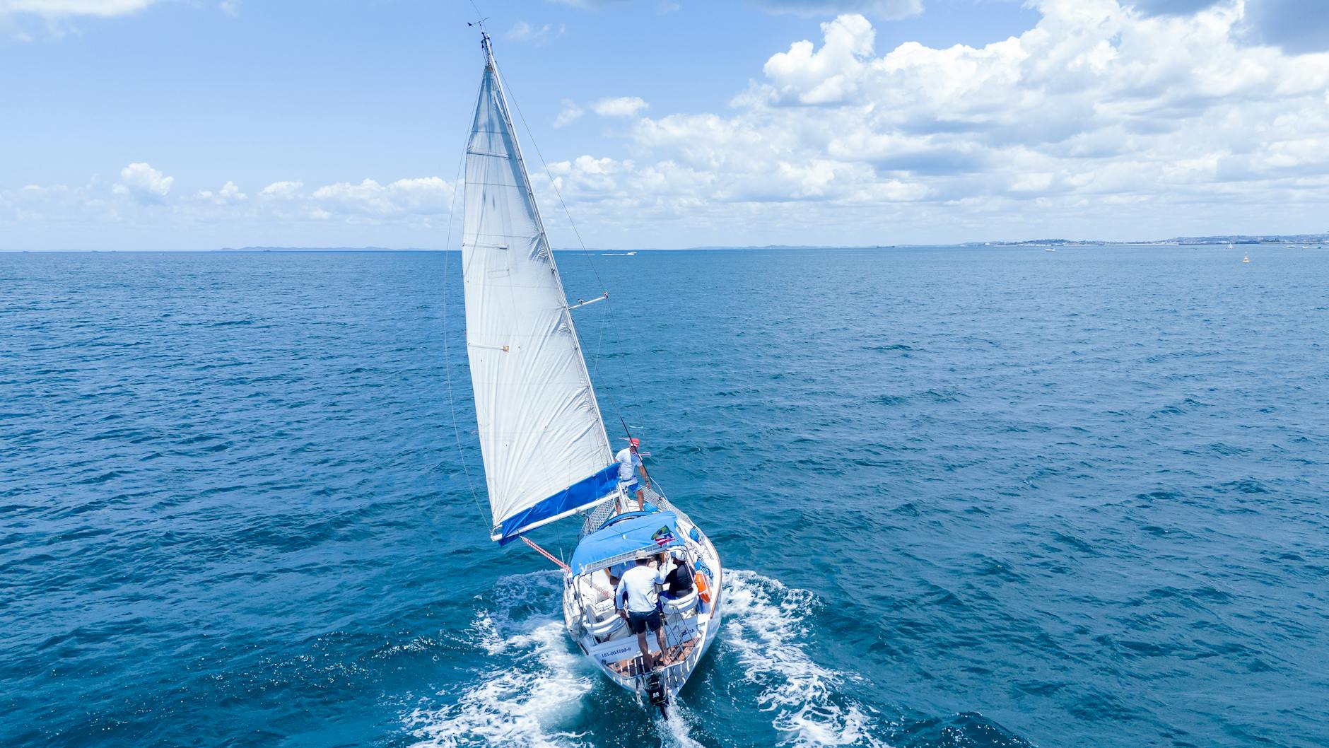 view of people sailing on a blue ocean